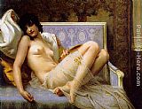 Young woman naked on a settee by Guillaume Seignac